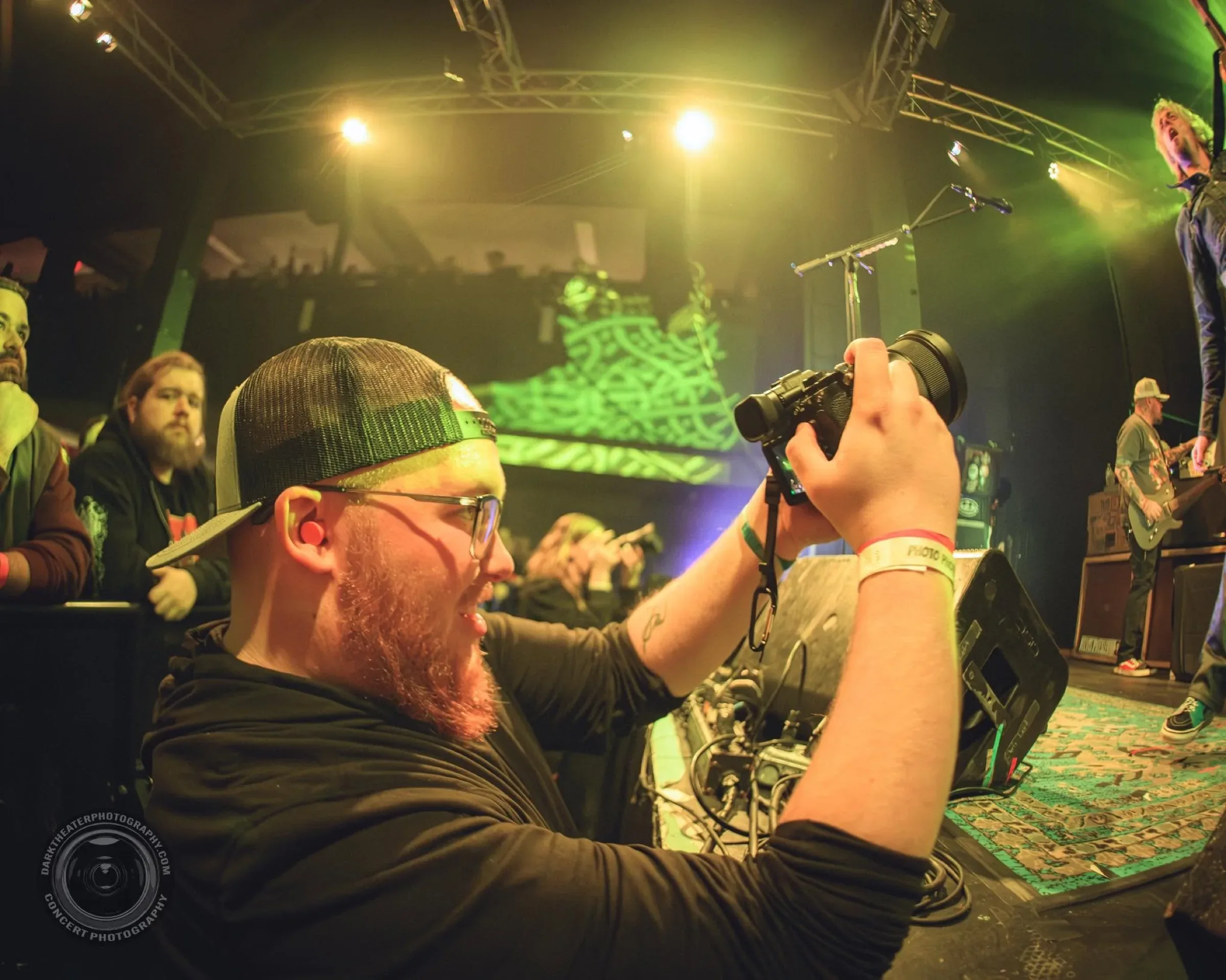 Aiden shooting from the photo pit during a live set